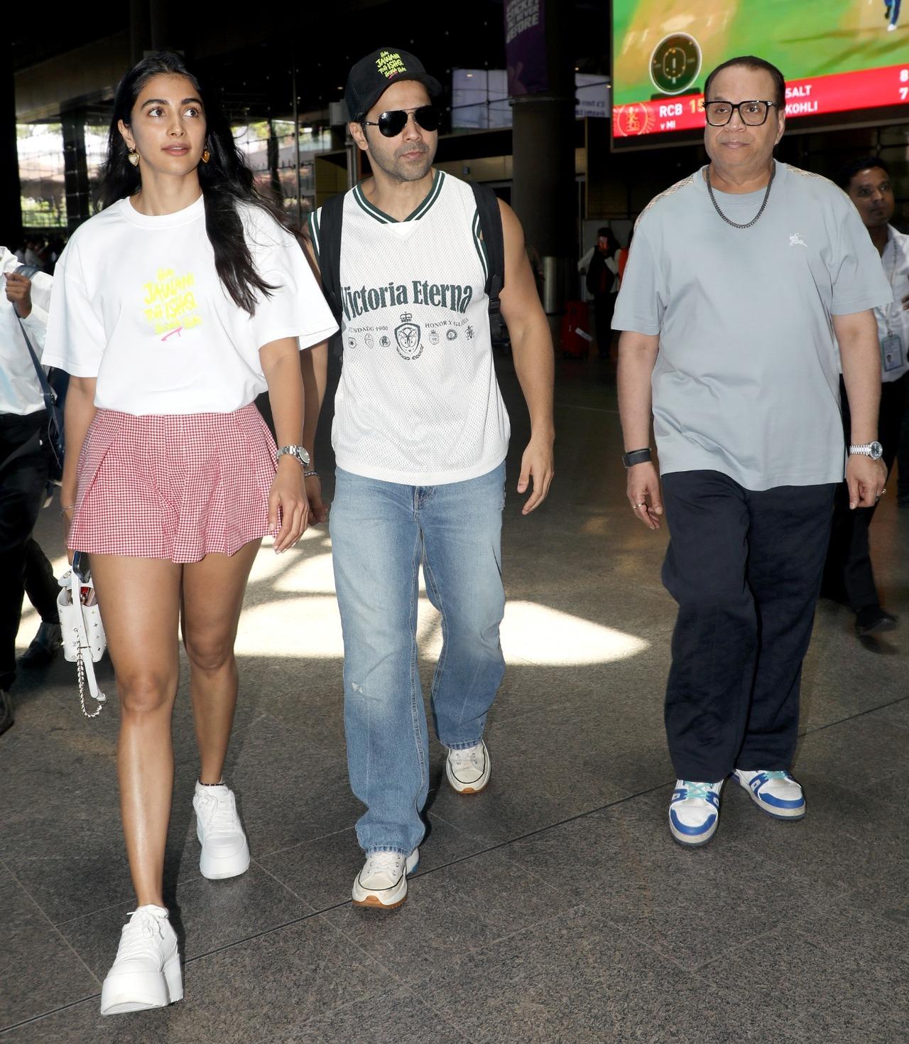 Pooja Hegde, Varun Dhawan and producer Ramesh Taurani were seen arriving at the airport together. Pooja Hegde, Varun Dhawan and producer Ramesh Taurani were seen arriving at the airport together.